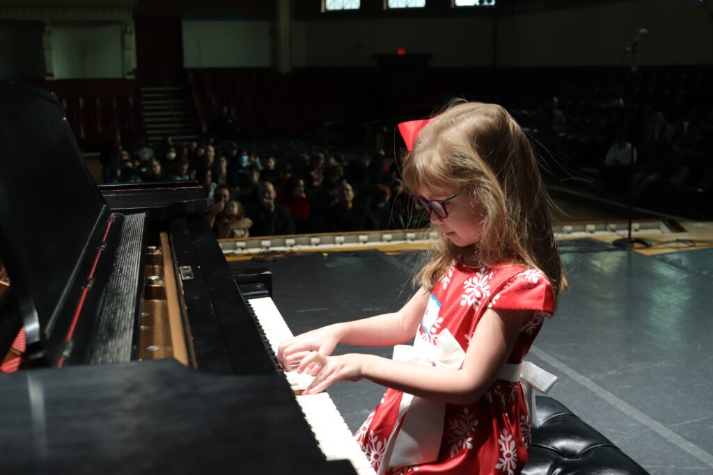 Little girl playing the piano