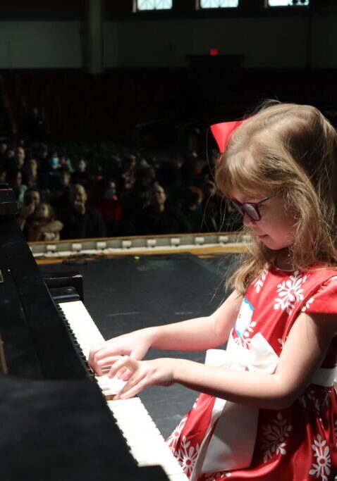Little girl playing the piano